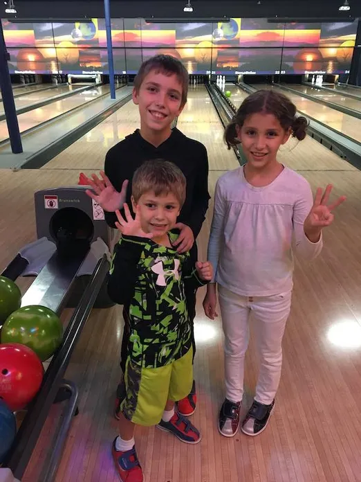 The kids bowling.