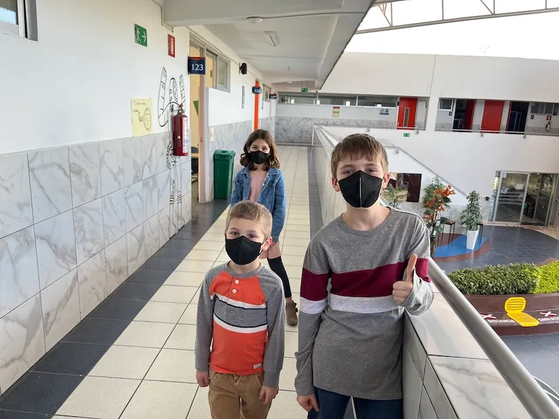 The kids standing in their temporary school